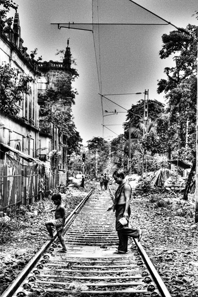 Boy And Man On The Railroad (India)
