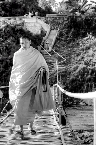 Monk On The Shabby Bridge (Laos)