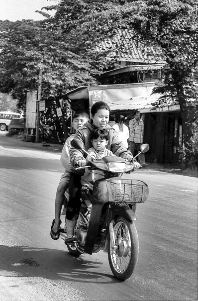 Mother and two sons on motorbike