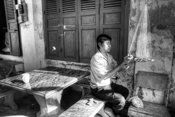 Man repairing fishing net