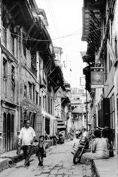 Father And Little Daughter In The Lane (Nepal)