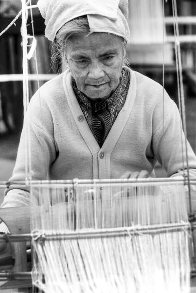 Older woman weaving