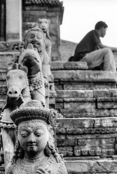 Statues And A Figure (Nepal)