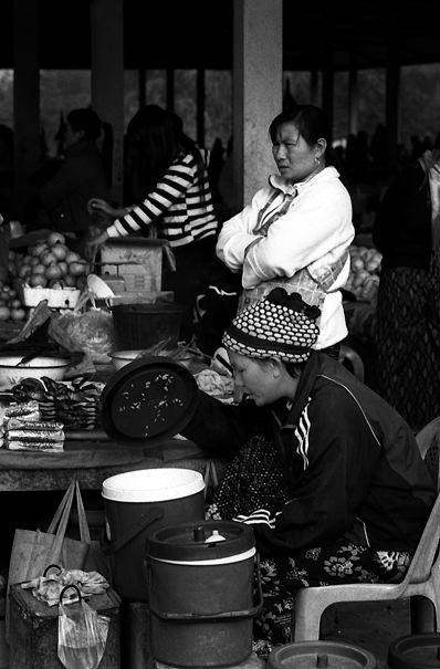 Women Working At The Market (Laos)