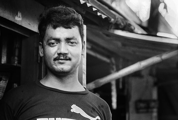 Tall Man In The Storefront (India)