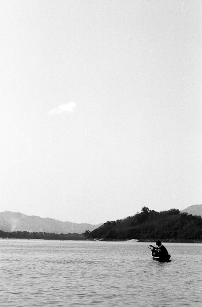 Lonely Fisherman In The Mekong River (Laos)