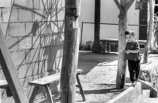 Boy And A Wooden Column (Laos)