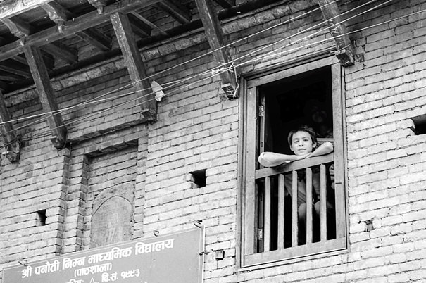 Boy Watching From The Window (Nepal)