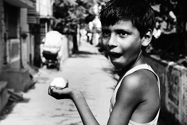 Boy holding mango