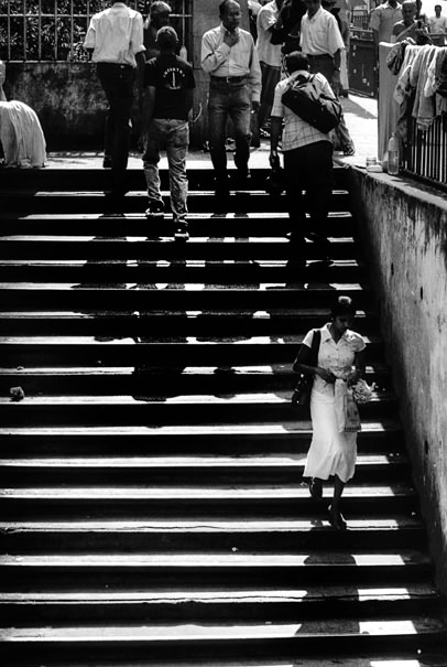 Young woman descending stairway