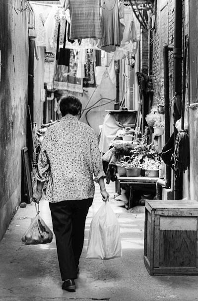 Woman Holding Plastic Bags (China)