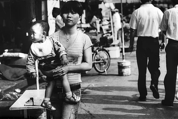 Stony-faced Mother And Her Curious Baby (China)