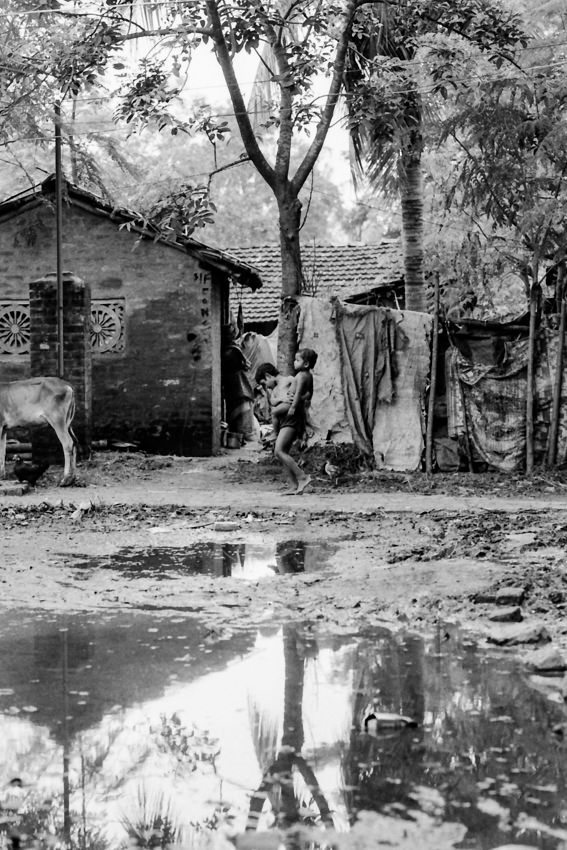 Boy on other side of big puddle