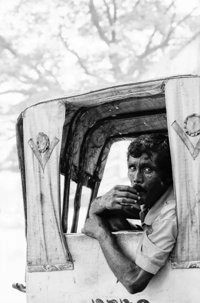 Rickshaw wallah looking back