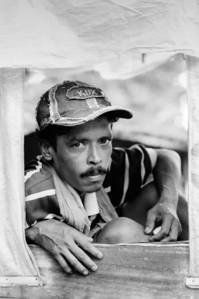 Rickshaw wallah wearing cap