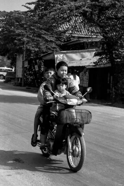 Mother and two sons on the same motorbike