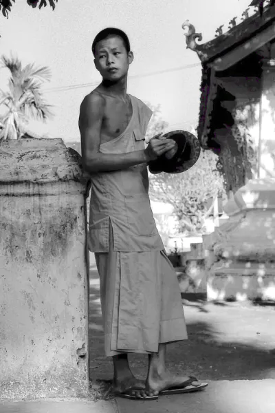 Young monk holding cymbals