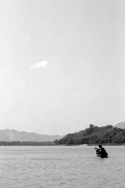 Lonely fisherman in Mekong river