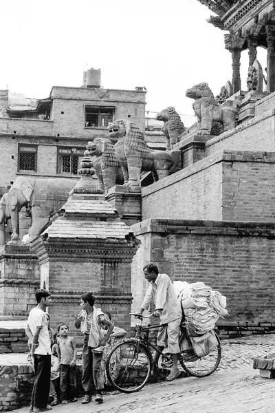 Locals standing talking beside Nyatapola Temple