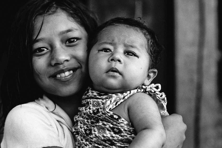 Girl holding baby