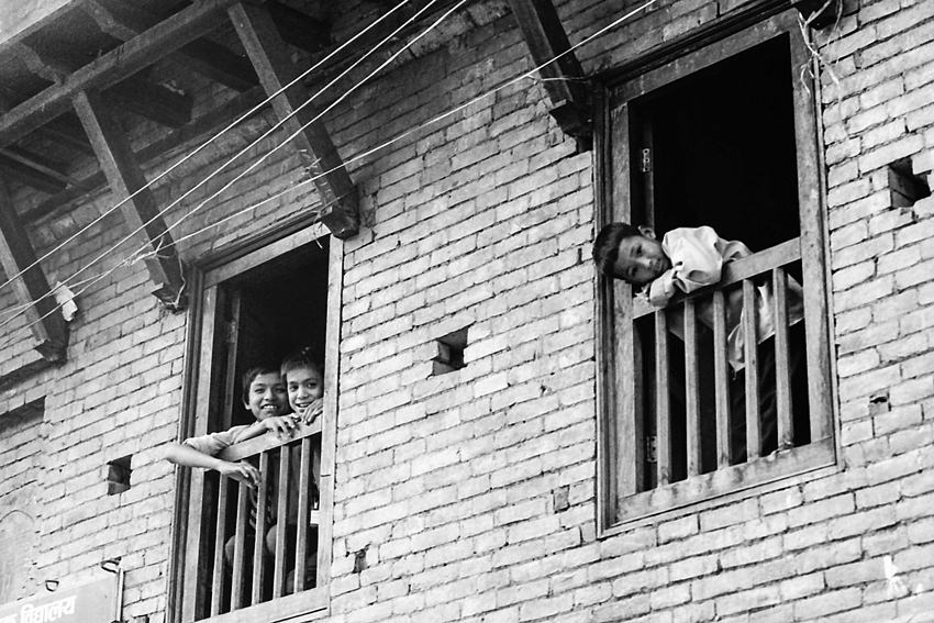 Boys leaning out of window