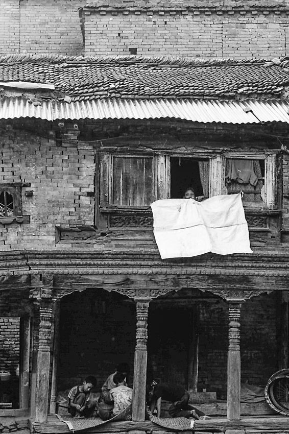 Boy watching from upstairs window