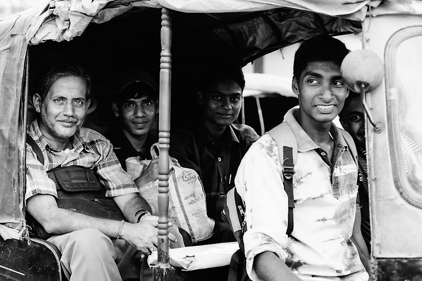 Passengers on auto rickshaw