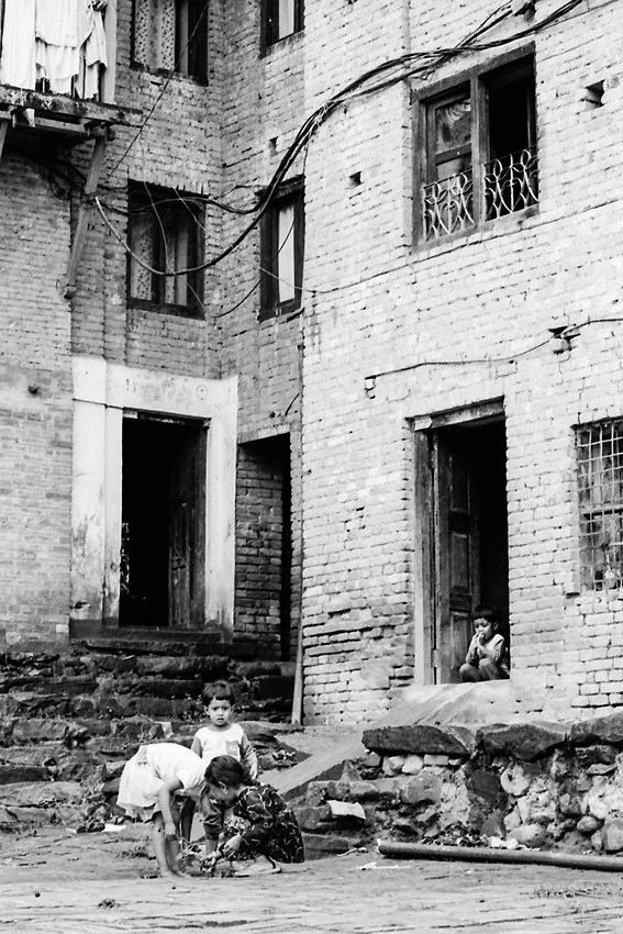 Children in the stone-paved street
