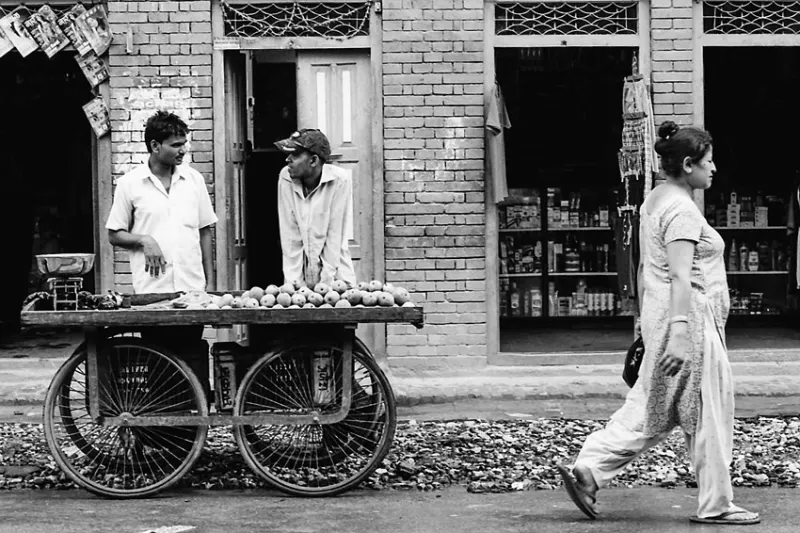 Men standing beside wagon