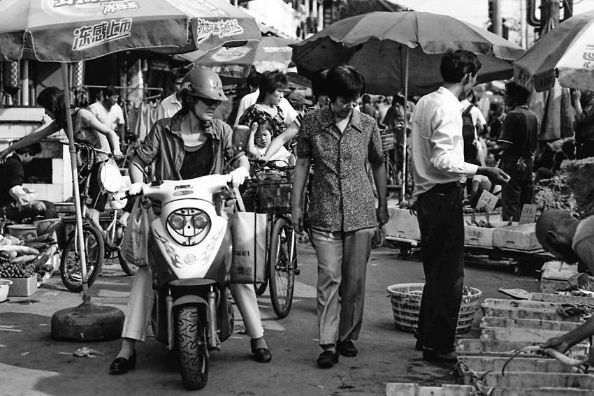 Shoppers in street market