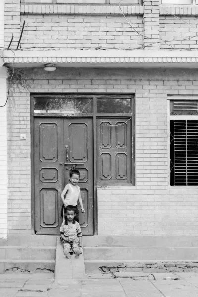 Boys playing in front of the door