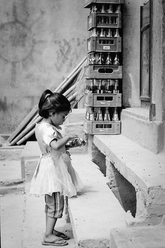 Little girl in front of general store