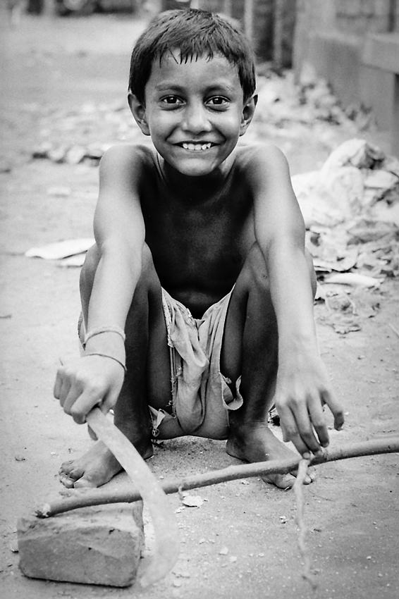 Smile of a boy holding chopper