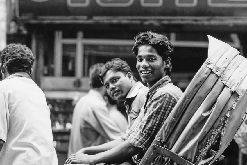 Passenger of cycle rickshaw smiling