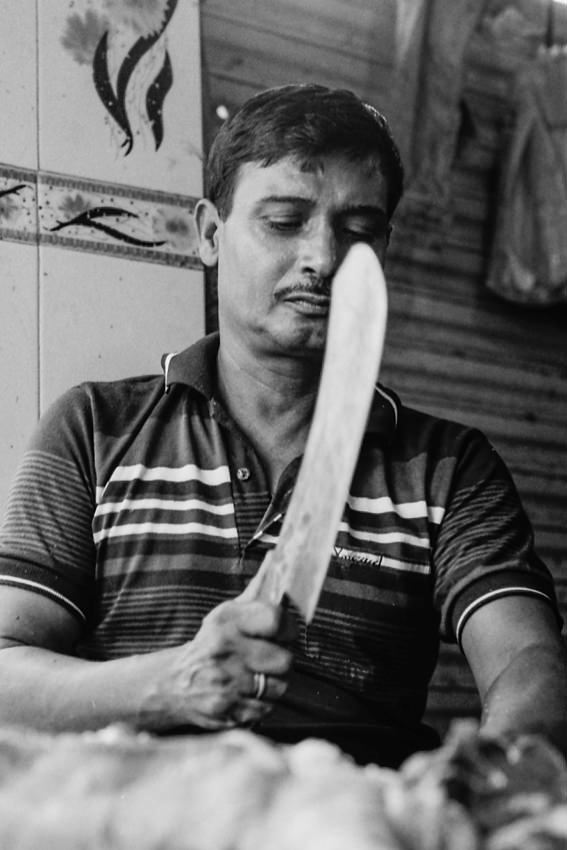 Butcher holding big knife