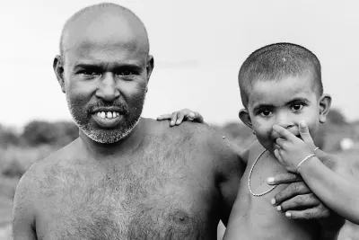 Shaven-bald father and his son