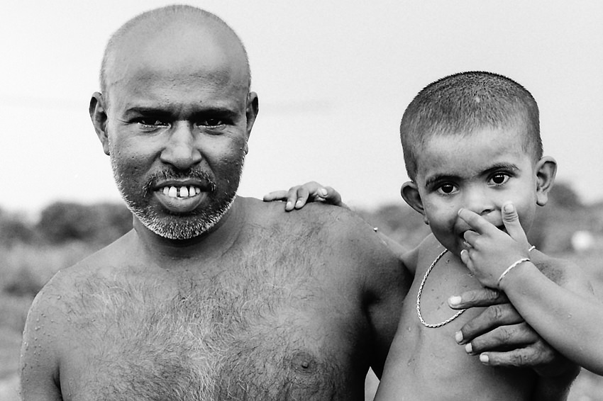 Shaven-bald father and his son