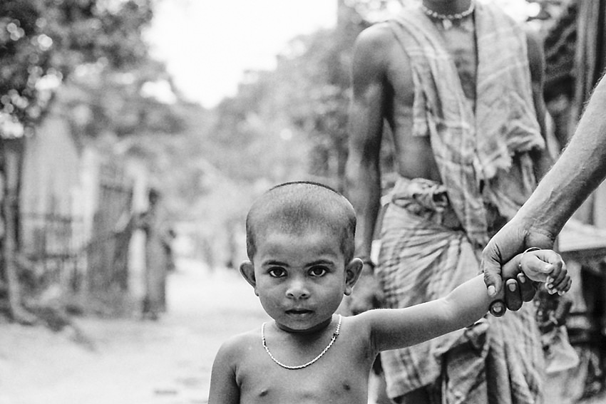 Boy taken by hand