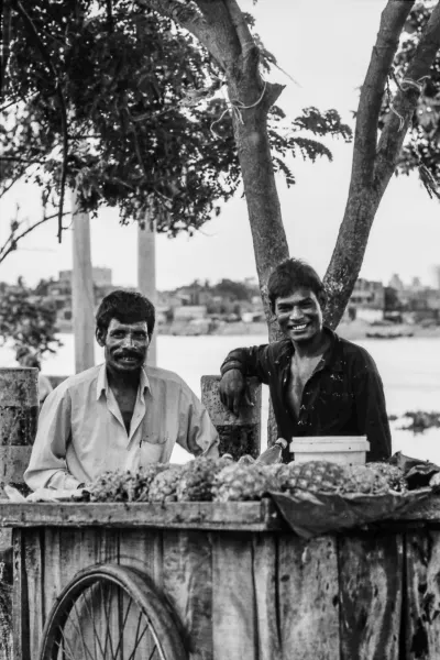 Men selling pineapples