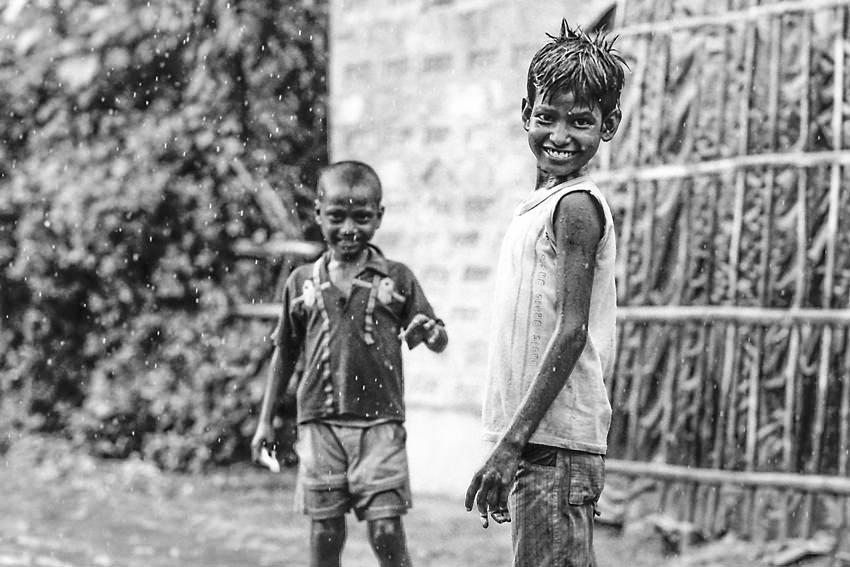 Boys playing in rain