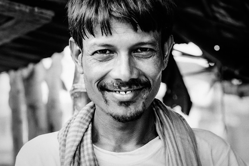 Man grinning a ghastly smile