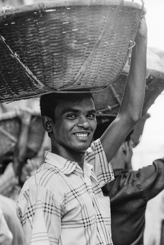 Man putting basket on head