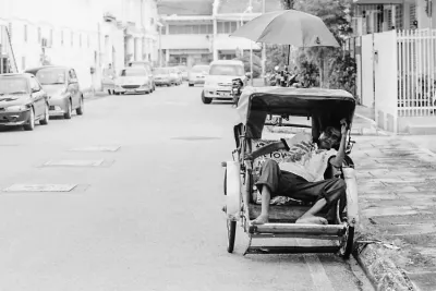 Pedicab driver taking a nap