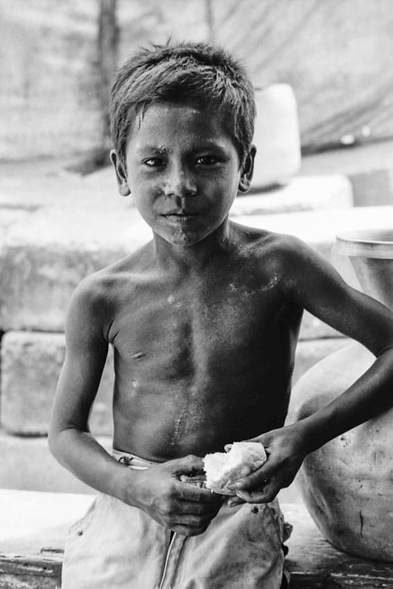 Boy holding a piece of bread