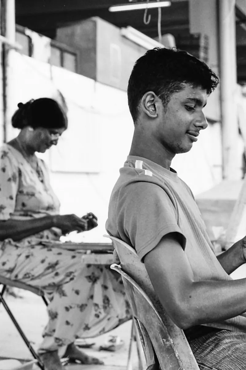 Relaxing man and working woman