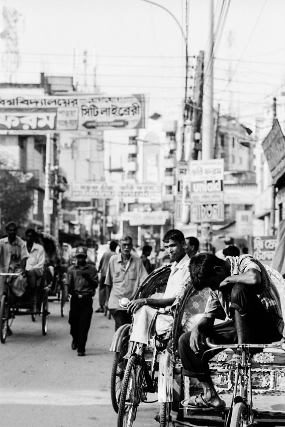 Rickshaw wallah in crowded street