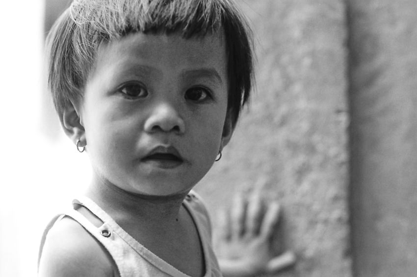 Little kid wearing pierced earring