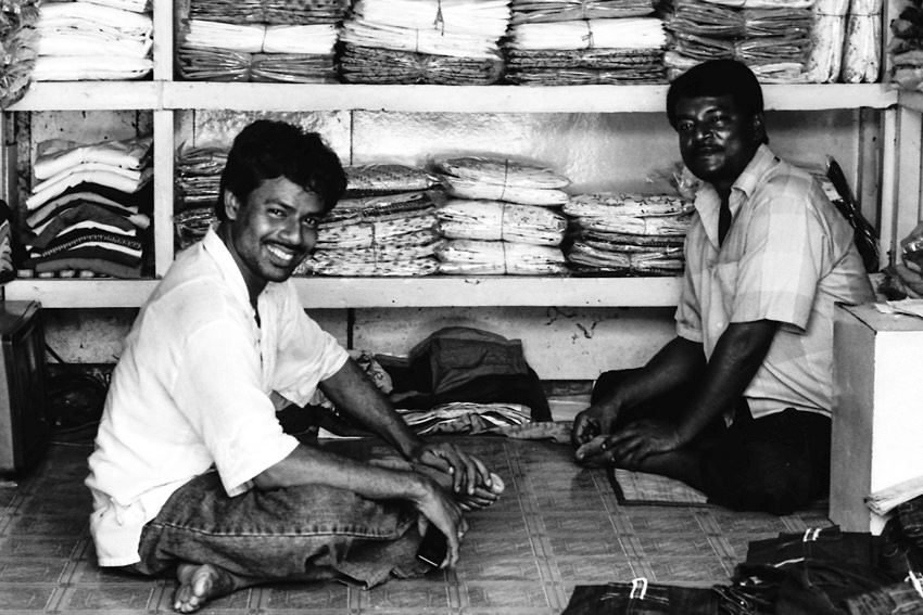 Men in front of the shelf