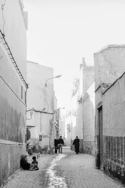 Figures in serene alleyway in Marrakesh