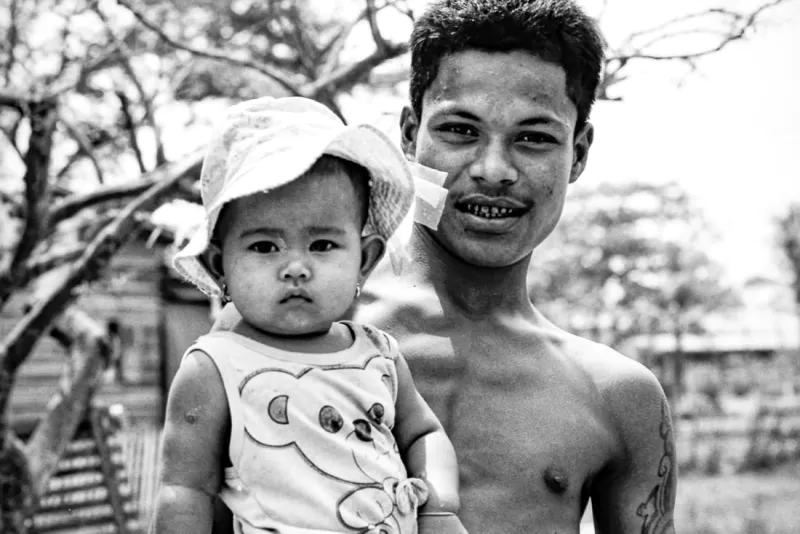 Father holding cute daughter